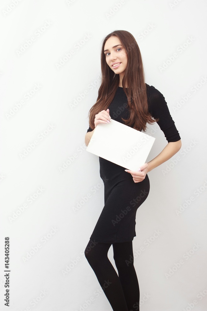 Woman student hold white blank card isolated on white background. Girl model poses. Woman student hold white blank card isolated on white background. Girl model poses.