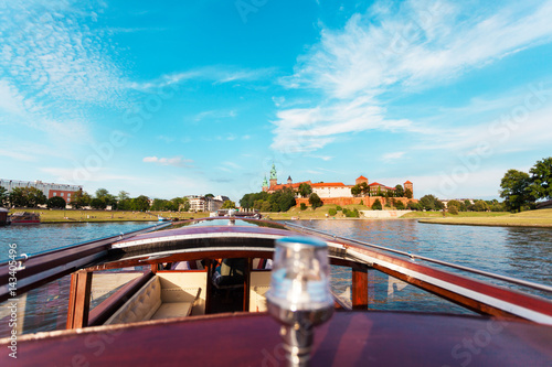 A beautiful view of Wawel Castle from a boat sailing along the Vistula River. Cracow, Poland.