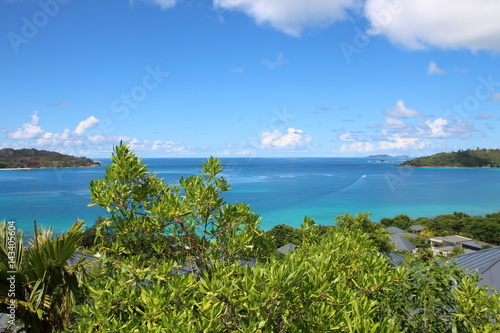 Anse Takamaka, Praslin Island, Seychelles, Indian Ocean, Africa / View to Curieuse Island.  © sarlay