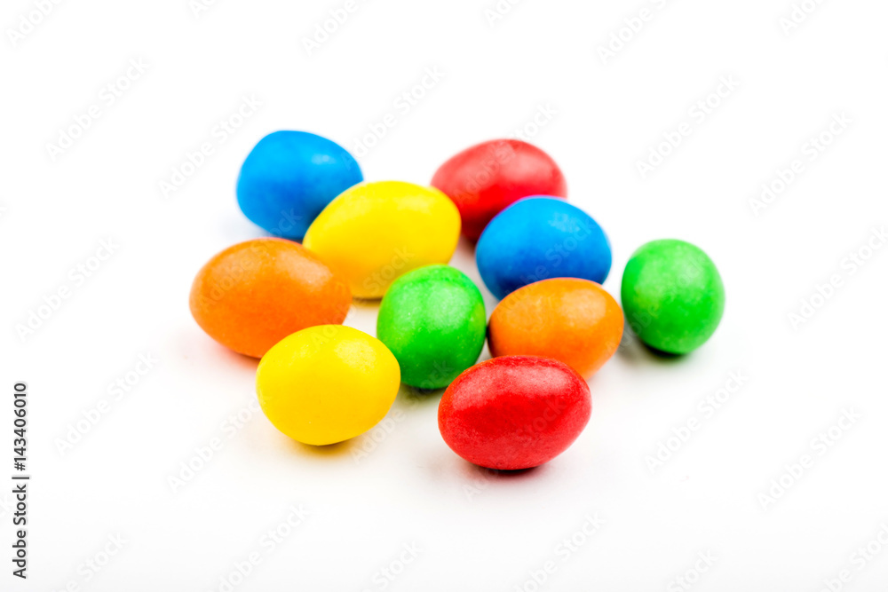 Colored chocolate candies, isolated on white background Colored chocolate candies, isolated on white background