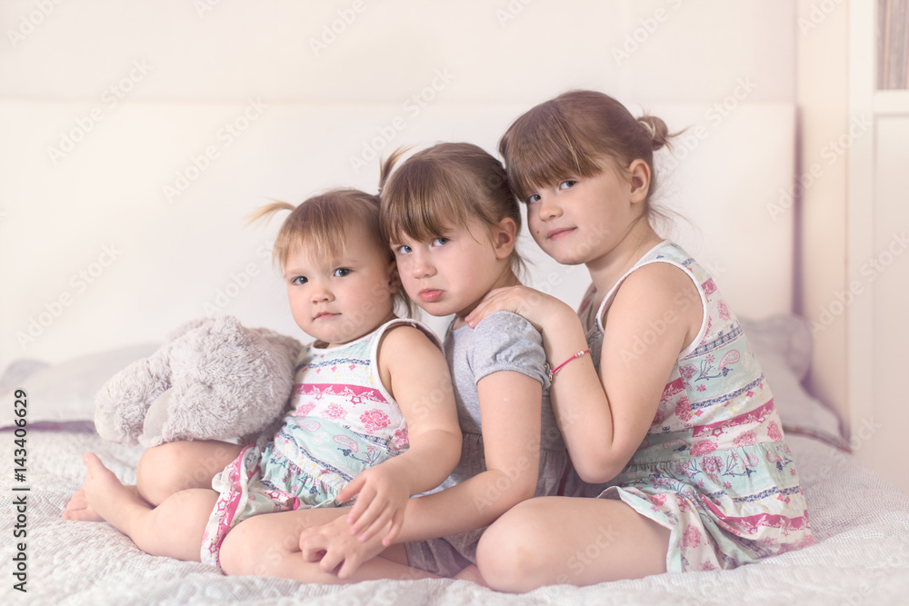 Three sibling sisters in real interior, lifestyle Three sibling sisters in real interior, lifestyle