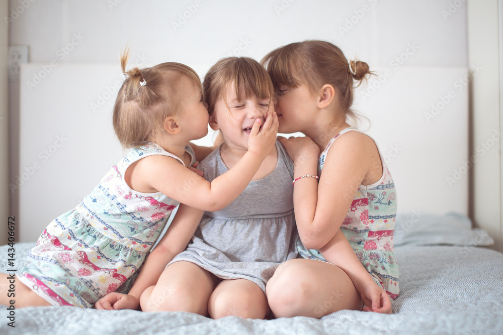 Three sibling sisters in real interior, lifestyle Three sibling sisters in real interior, lifestyle