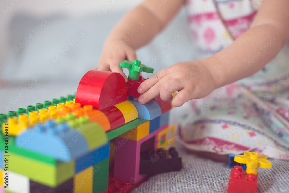baby builds house from designer, close-up, real baby builds house from designer, close-up, real