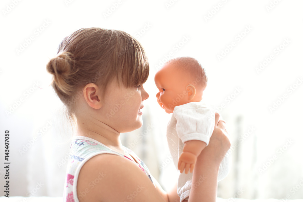 kid cares about doll, lifestyle in real interior kid cares about doll, lifestyle in real interior