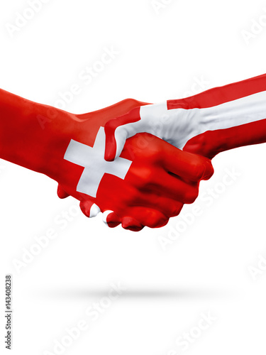 Flags Switzerland, Denmark countries, partnership friendship handshake concept.