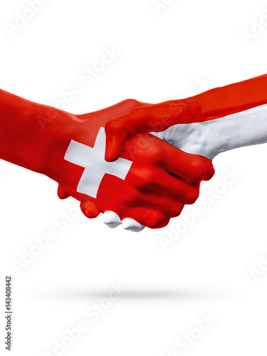 Flags Switzerland, Monaco countries, partnership friendship handshake concept.