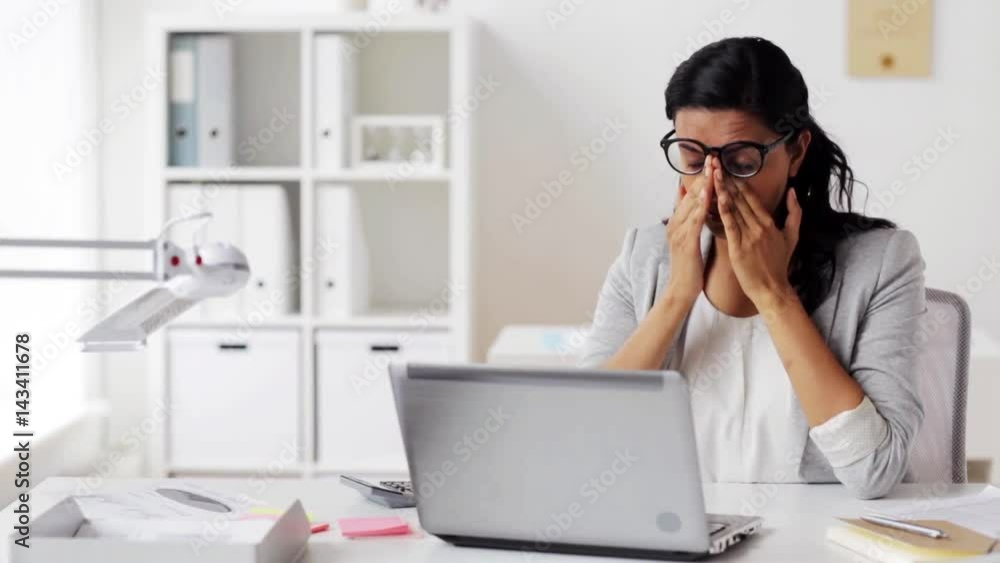 tired businesswoman in glasses at office tired businesswoman in glasses at office