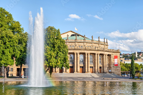 Stuttgart State Theatre building and fountain in Eckensee lake, Germany