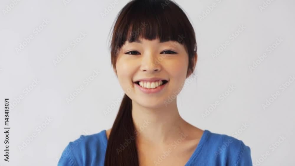 happy smiling asian young woman happy smiling asian young woman