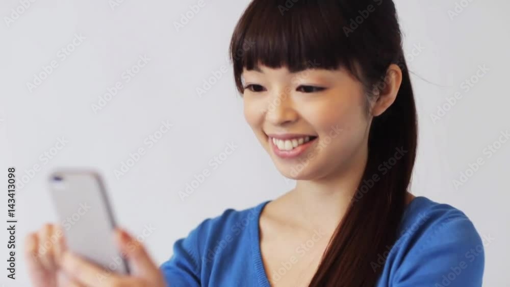happy smiling asian woman with smartphone happy smiling asian woman with smartphone