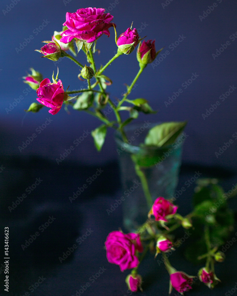 The pink flowers stands in the vase