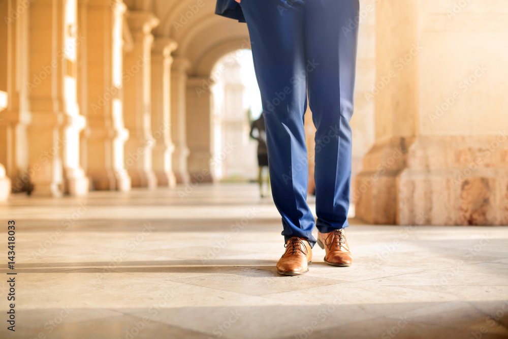 Businessman walking in the street Businessman walking in the street