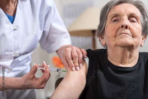 Senior woman getting an injection