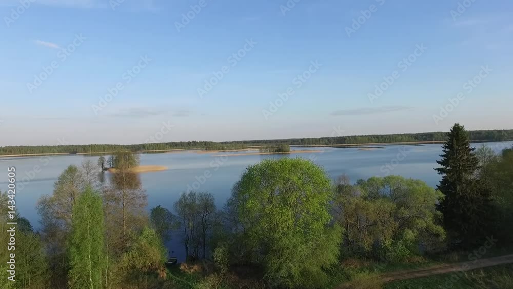 Aerial view of the spring afternoon on a lake with islands Aerial view of the spring afternoon on a lake with islands