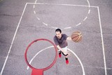 Basketball player outdoor practicing. Street ball.