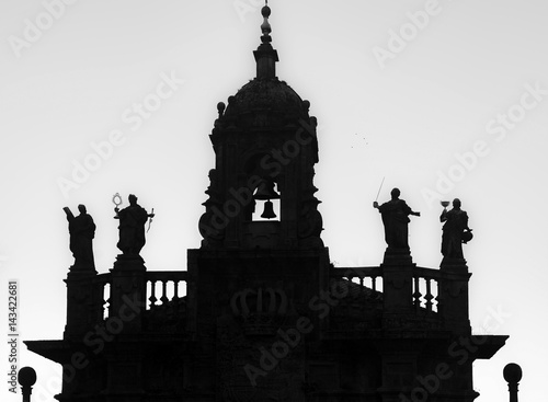 Silhouette church, San Fructuoso. Baroque style. Bell tower and statues of the four cardinal virtues.Santiago de Compostela.