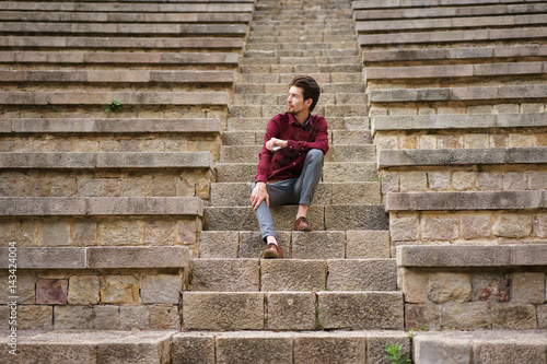Man sitting on old stairs