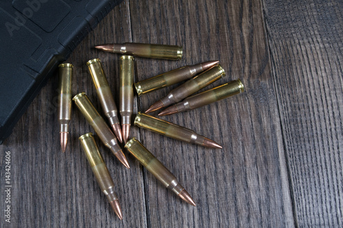 Group of ammunition on a dark wooden background. 