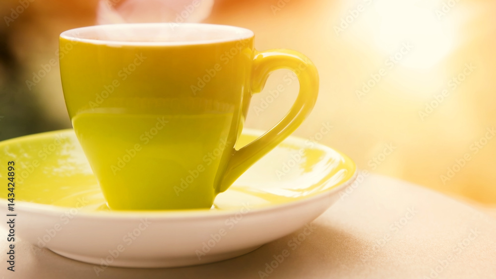 green cup of coffee in the sunlight green cup of coffee in the sunlight