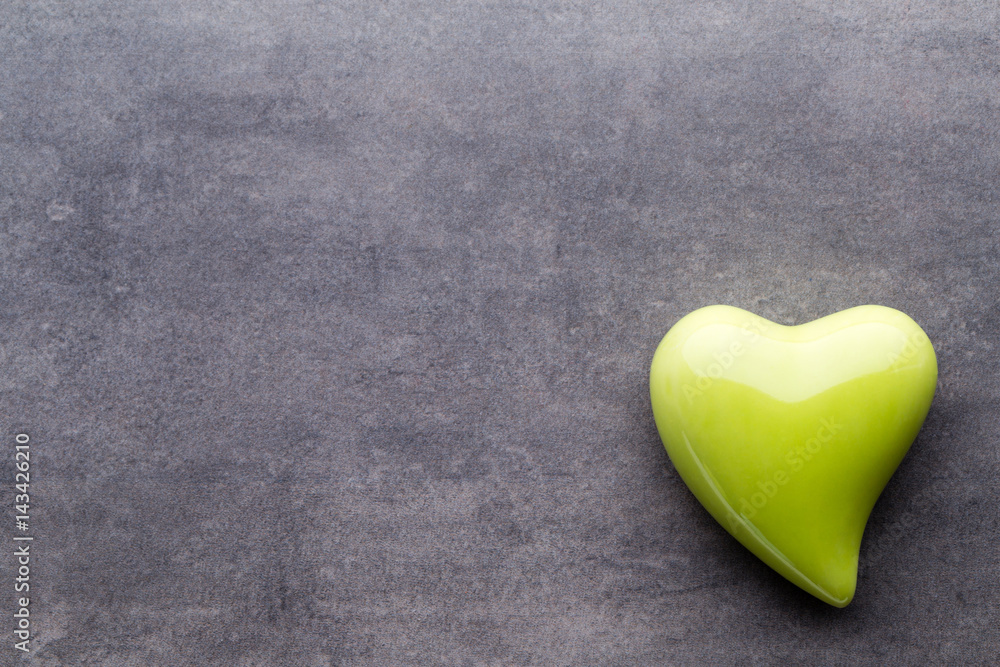 Colored heart on the gray background. View from above. Flat lay. Colored heart on the gray background. View from above. Flat lay.