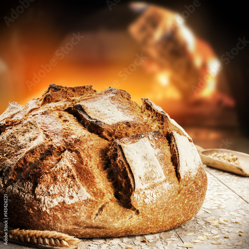 Freshly baked bread in rustic bakery with traditional oven