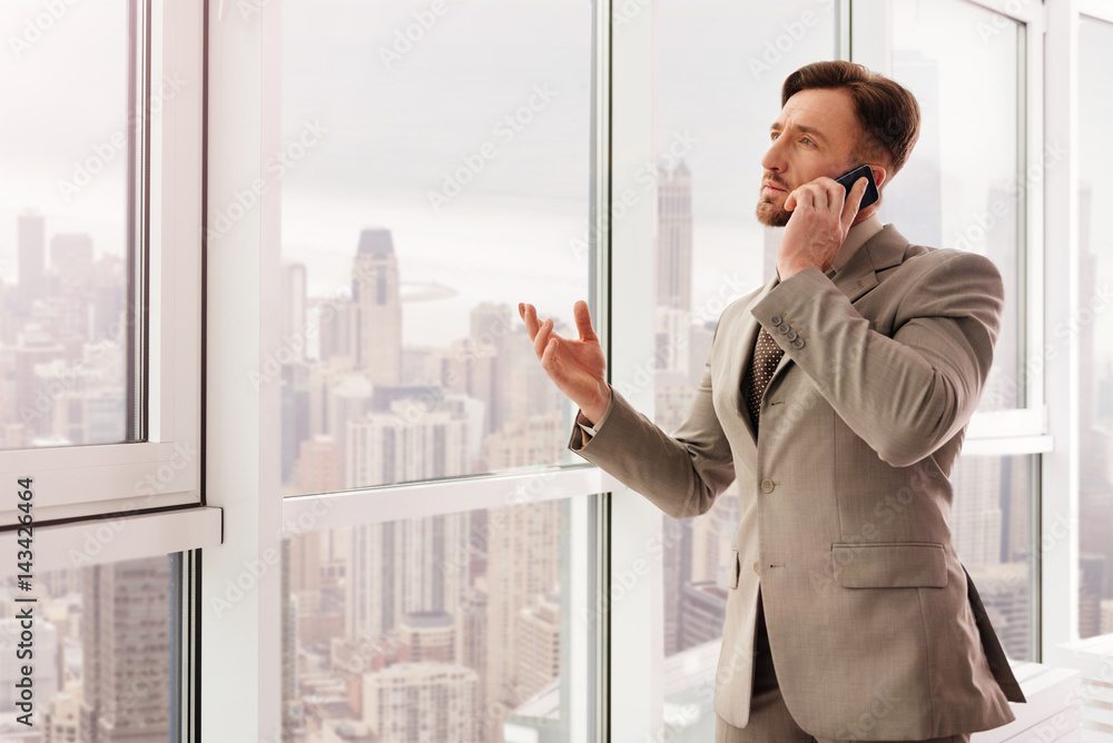 Successful businessman talking on smartphone Successful businessman talking on smartphone
