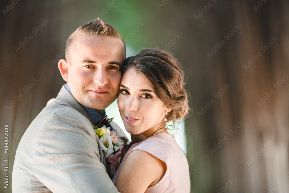 Blurred picture of beautiful couple hugging each other in the forest Blurred picture of beautiful couple hugging each other in the forest