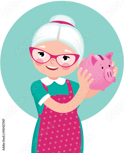 Grandmother a pensioner in an apron shakes a piggy bank