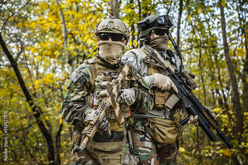Two United states Marine Corps special operations command Marine Special Operators also known as Marsoc raiders in camouflage uniforms in the forest © Getmilitaryphotos