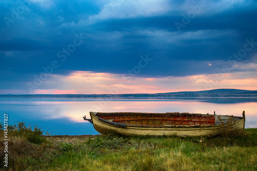 Fishing boat by a lake