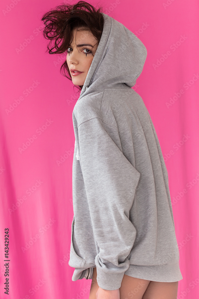 Woman back portrait wearing grey hoodie Woman back portrait wearing grey hoodie