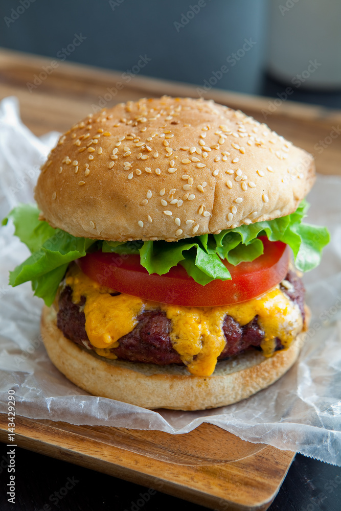 Cheeseburger stacked high with lettuce and tomato