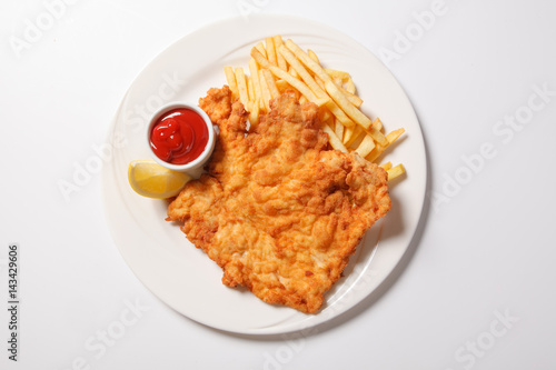 Fried fish and chips on the white plate