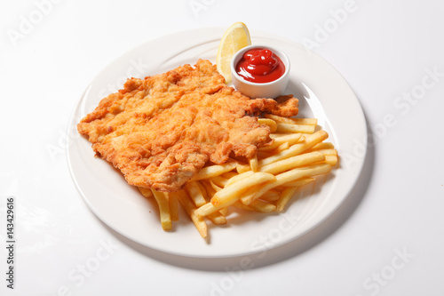 Fried fish and chips on the white plate