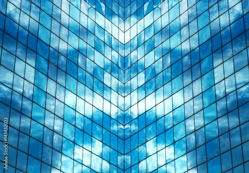 Reflected blue sky in skyscraper windows