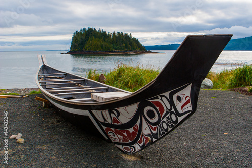 Haida Boat on the shoreline of Haida Gwaii photo