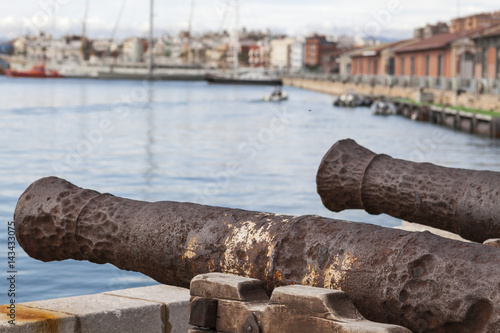 Old cannons in port of Tarragona,Spain.