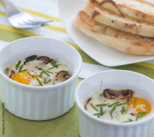 Baked egg with mushrooms and toast