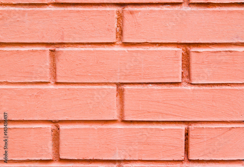 Background of brick wall and bright orange color