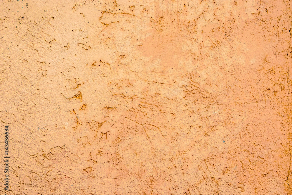 The surface texture of the cement walls, painted in light brown paint ochre The surface texture of the cement walls, painted in light brown paint ochre