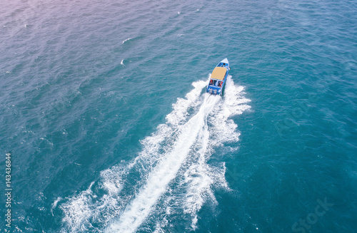 speed boat running fast in the sea coast in aerial view
