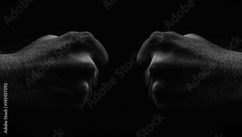 Male Fist On Black Background