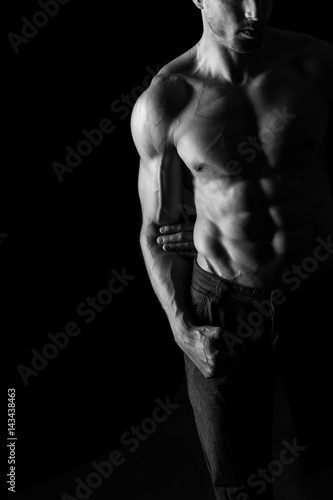 Sexy Shirtless Muscular Male Model on Black Background