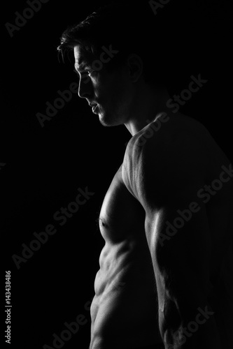 Sexy Shirtless Muscular Male Model on Black Background