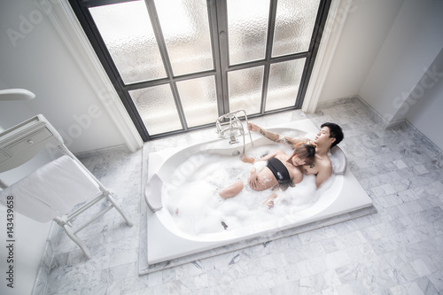Pregnant woman with her husband spend much time together