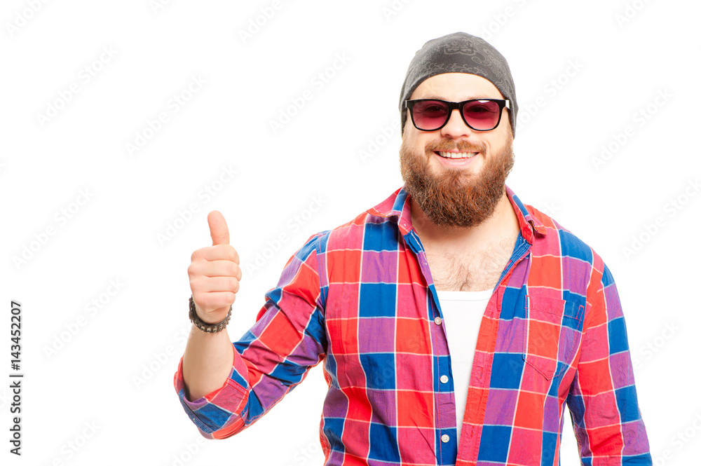 Great job! Happy young bearded man in sunglasses showing his thumb up while standing against white background Great job! Happy young bearded man in sunglasses showing his thumb up while standing against white background