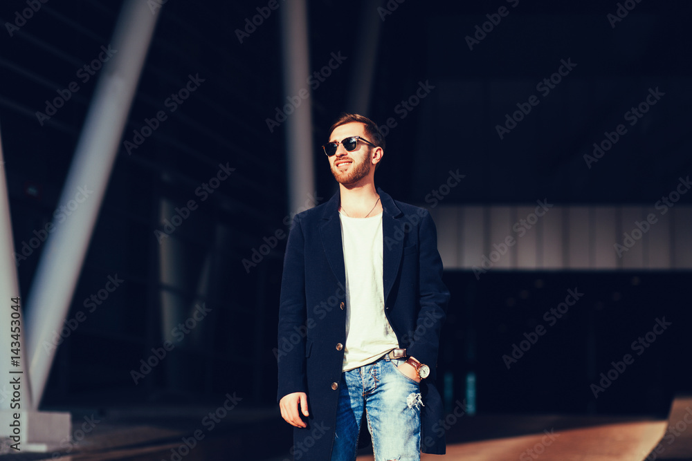 Fototapeta premium portrait of a handsome man wearing jacket and sunglasses