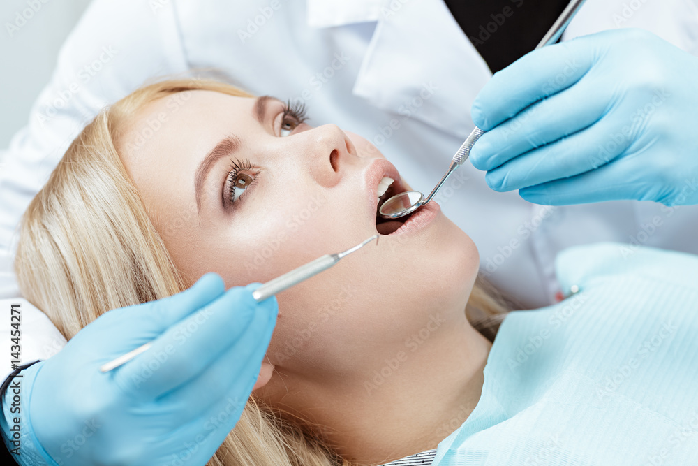 In good hands. Cropped closeup of a young female client at the dental examination In good hands. Cropped closeup of a young female client at the dental examination