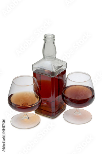 Bottle with brandy and cognac on white background