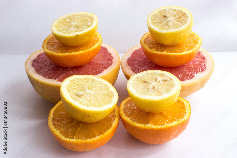Fototapeta premium Citrus fruits being cut in half